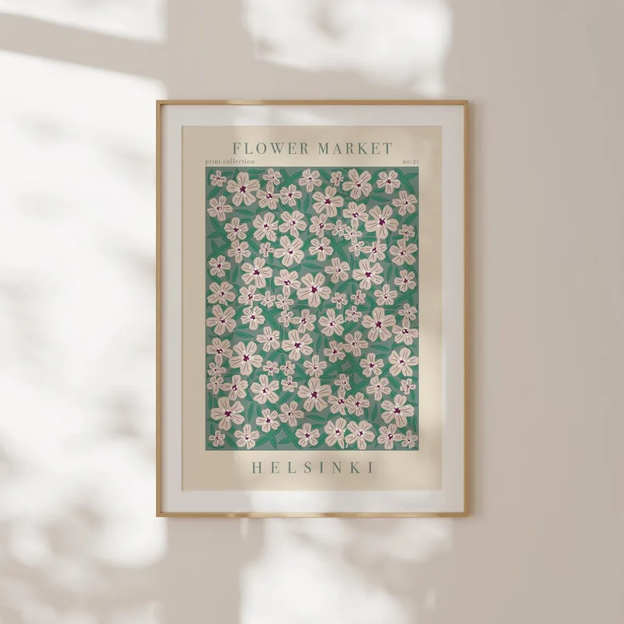 Helsinki Flower Market Print: Pale pink five-petal flowers with dark centres on green, shown framed on a wall