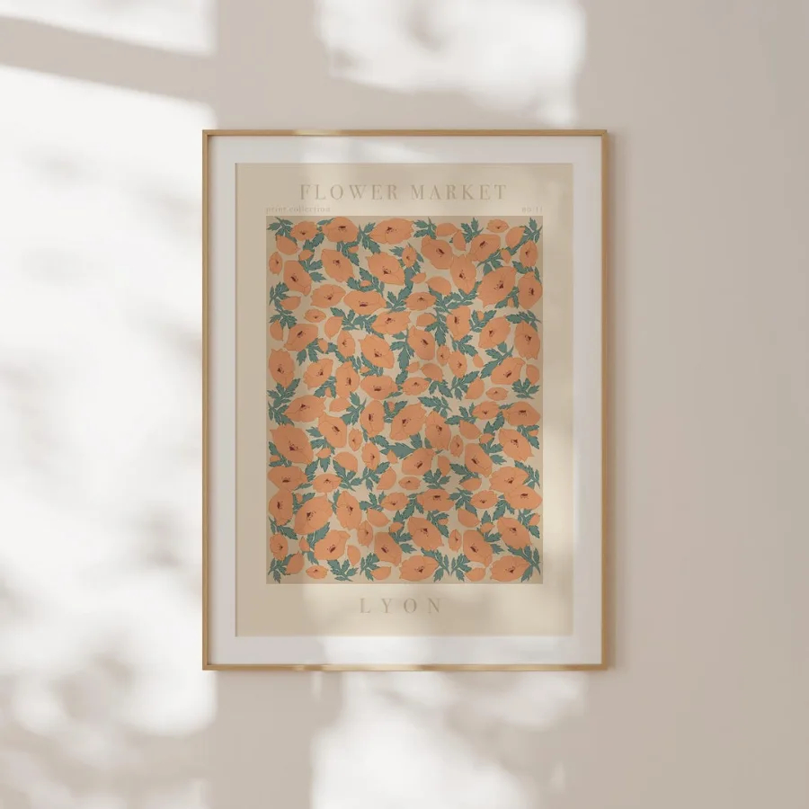 Lyon Flower Market Print: Orange blooms with blue-green leaves on cream, shown framed on a wall